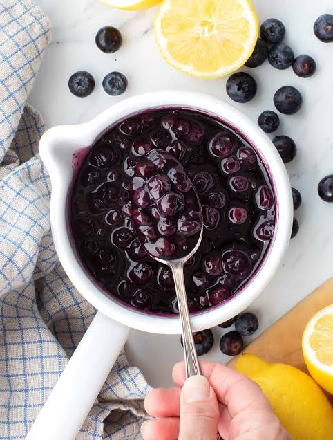 Homemade blueberry compote with fresh lemon