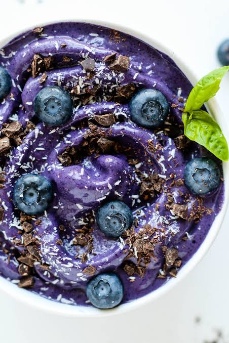 Creamy blueberry nice cream with fresh blueberries and chocolate